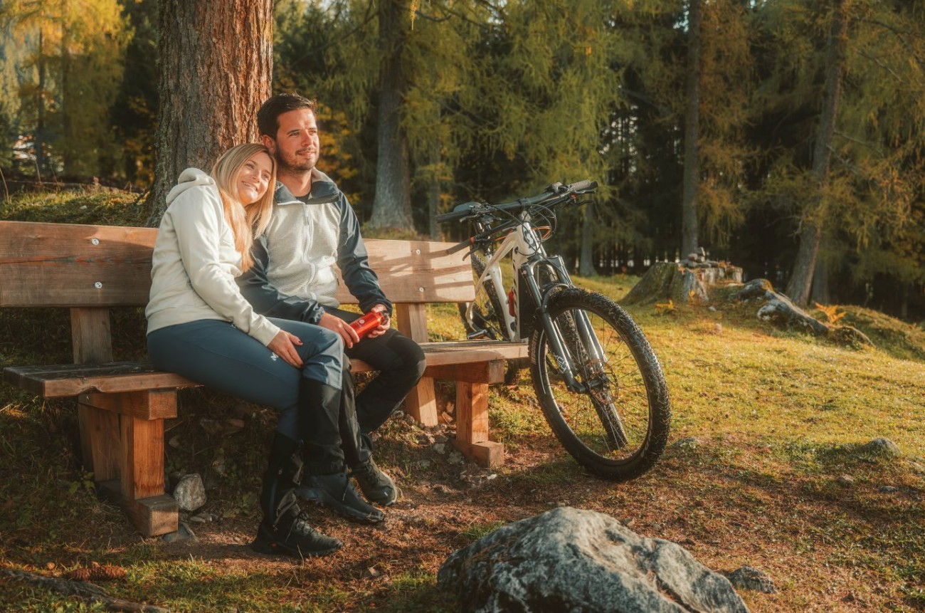 Couple resting on a bike tour near Schladming, Austria