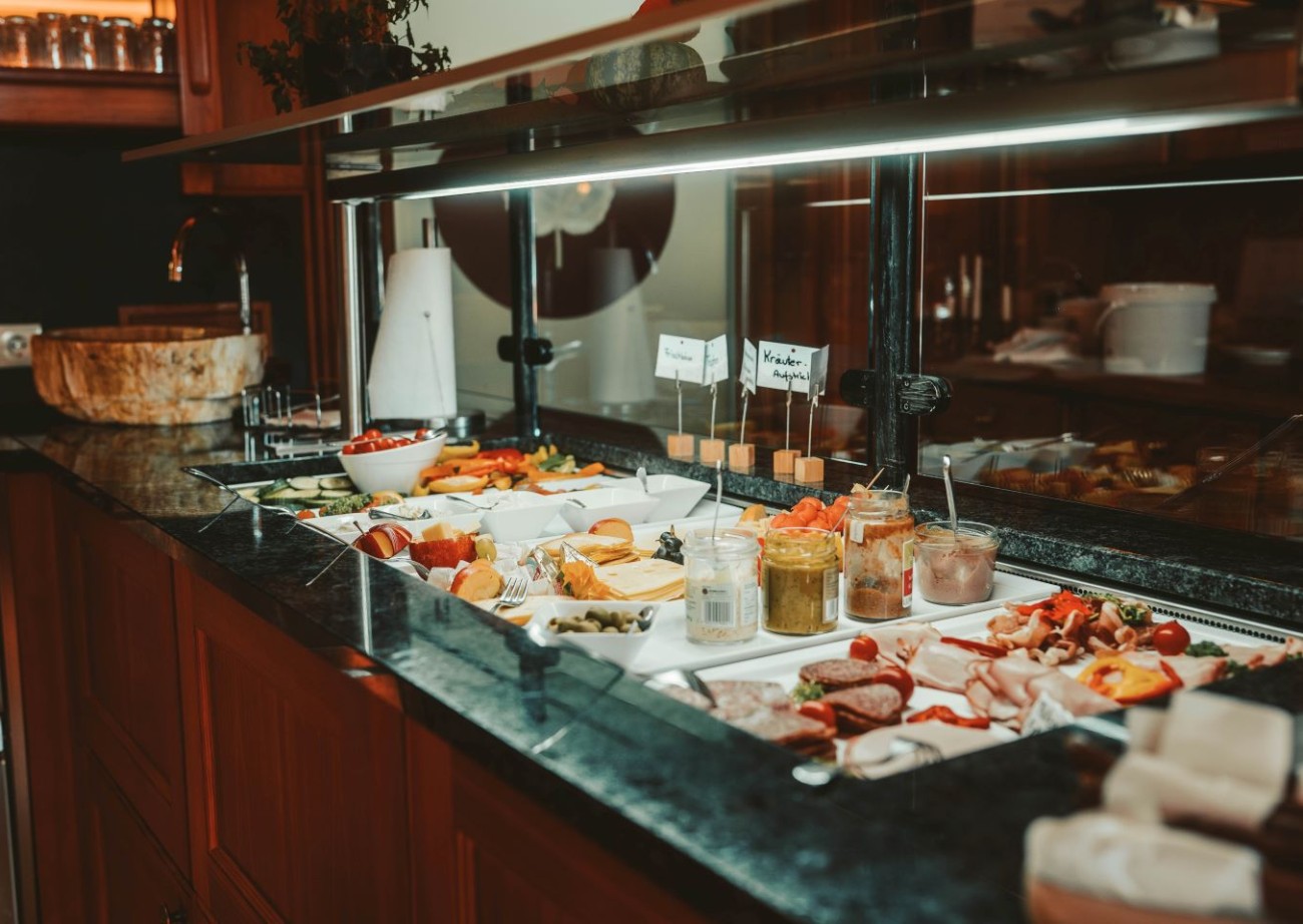 A rich and varied breakfast buffet offering a selection of fresh and high-quality foods at Hotel Lindenhof in Ramsau am Dachstein