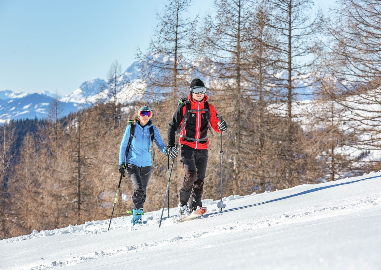 Two hikers on a snow-covered path