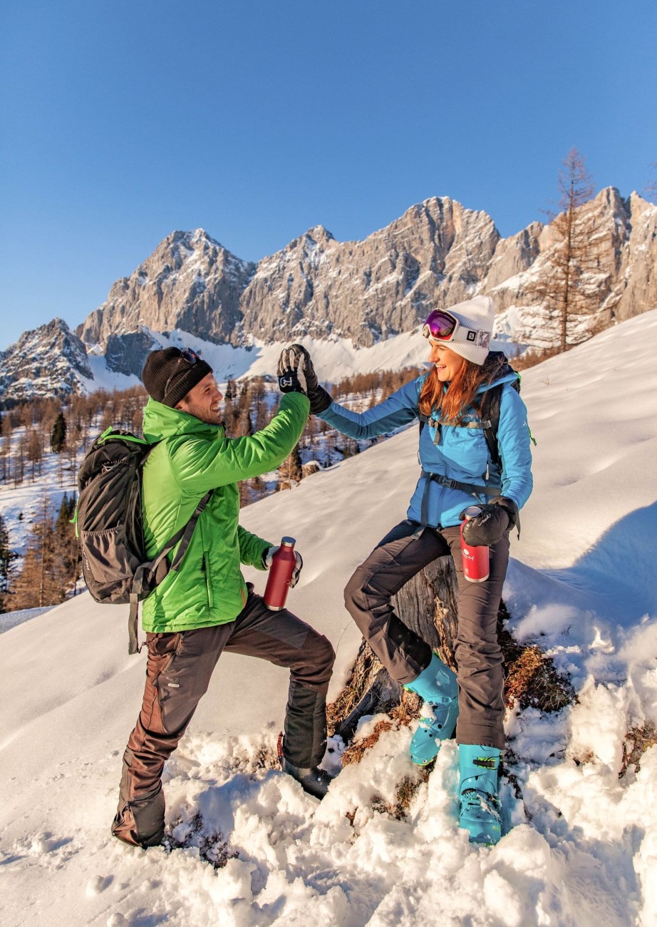 A couple takes a break while snowshoeing