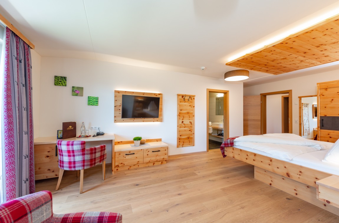 Spacious bedroom in the Swiss Stone Pine Suite